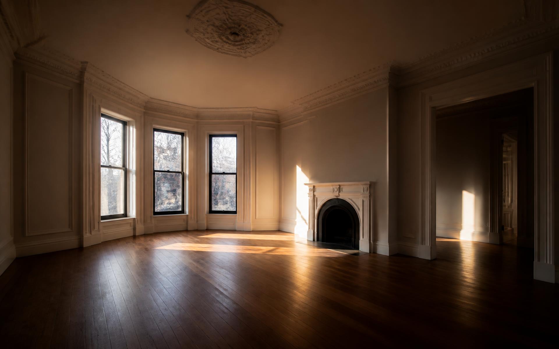 A cleared, sunlit living room ready for its next chapter